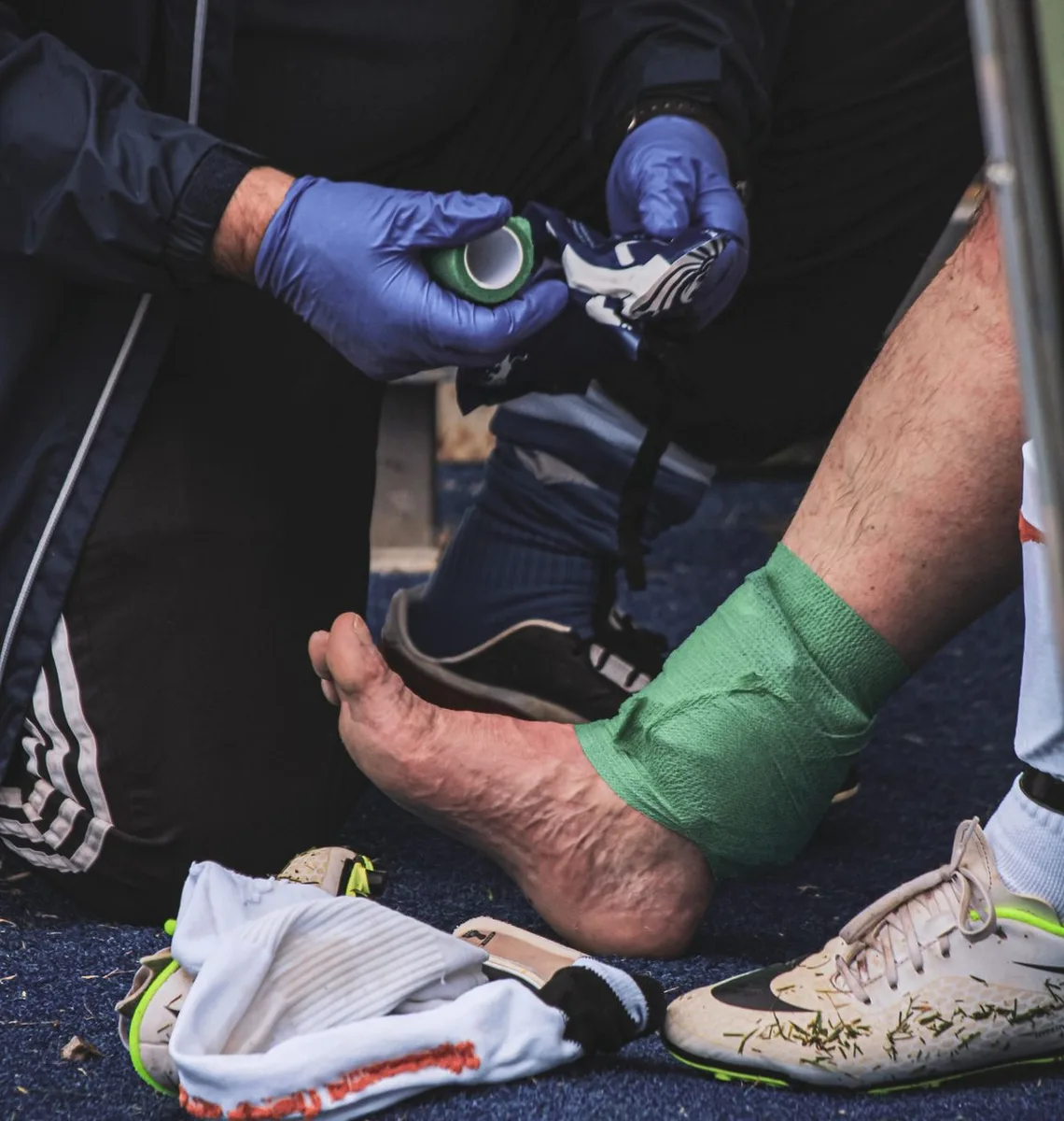 Ankle being taped after a sports injury