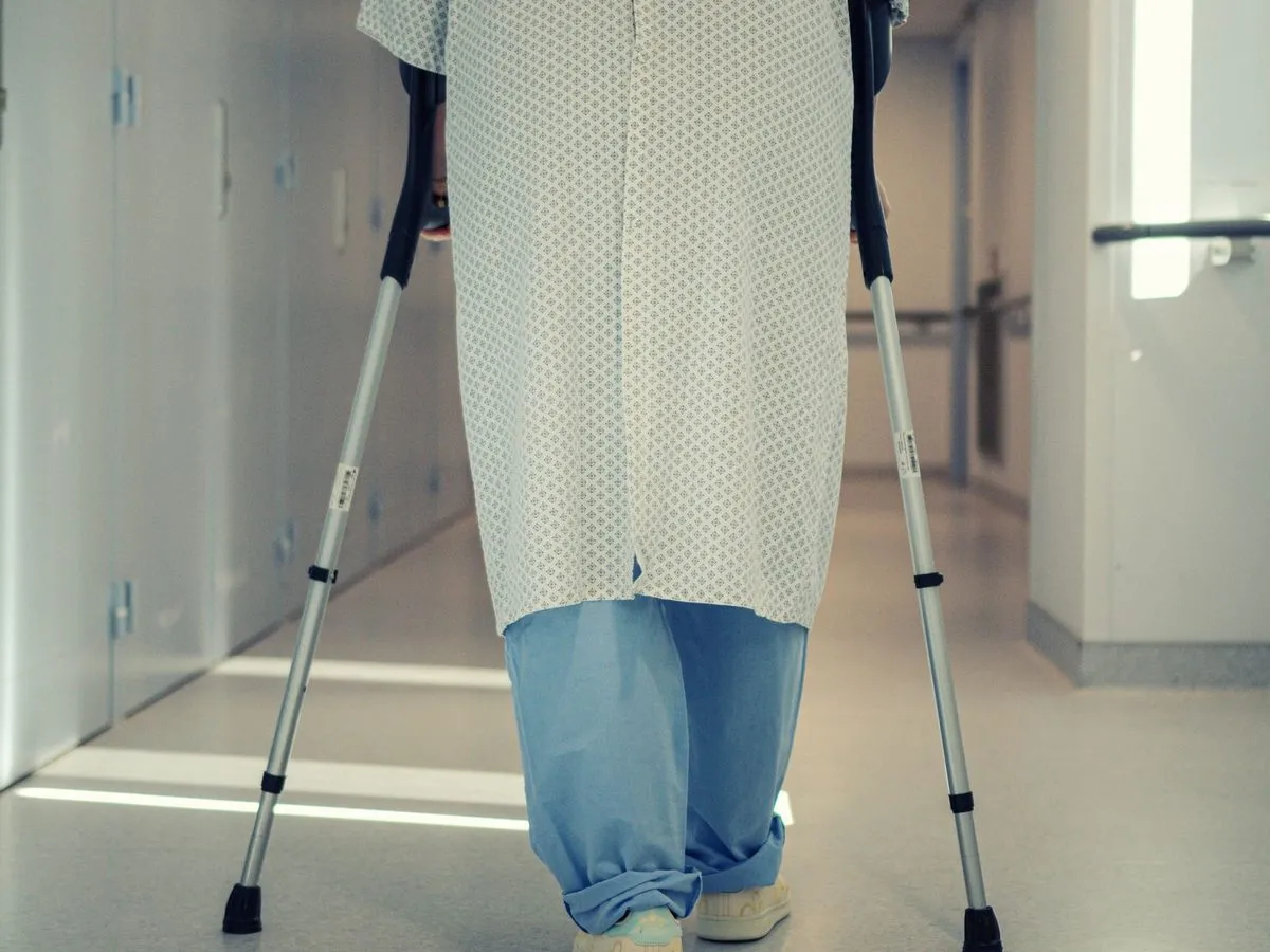 Patient walking with crutches after surgery