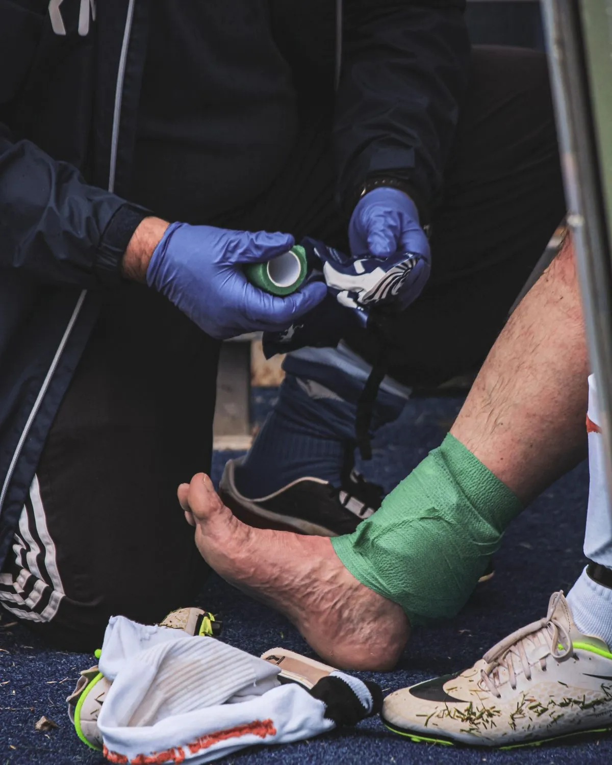 Ankle being taped after a sports injury